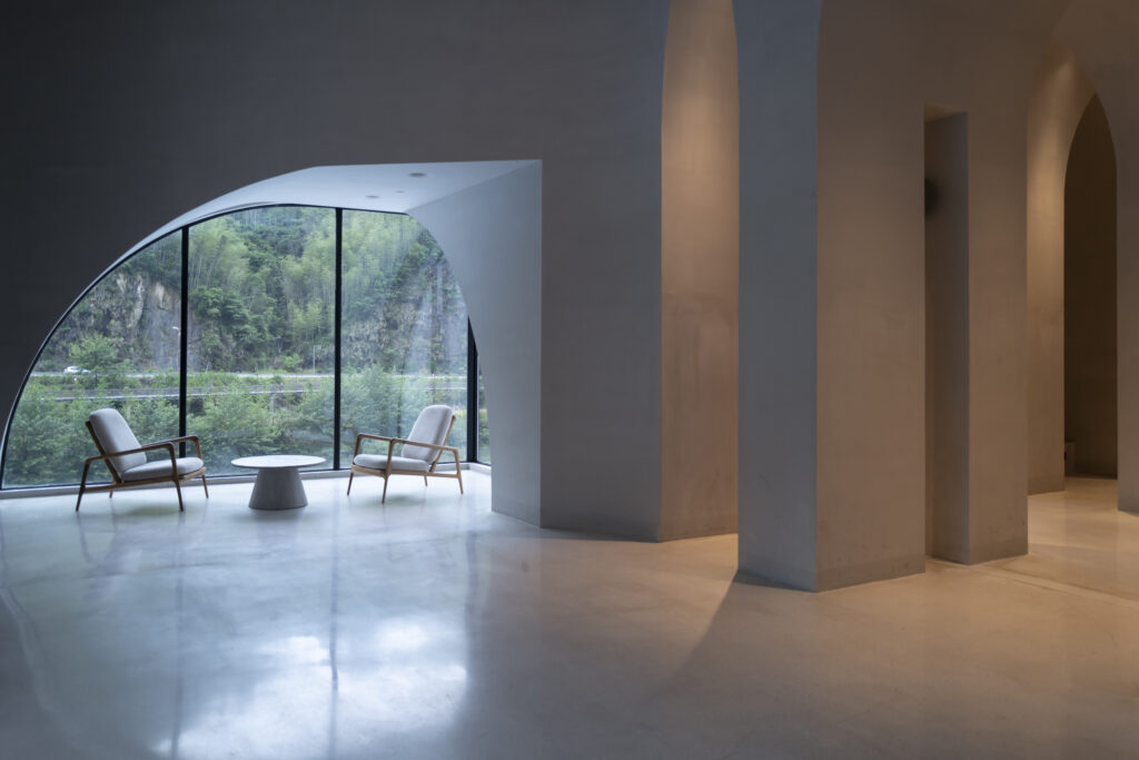 The lighting effect of an empty modern concrete curved corridor